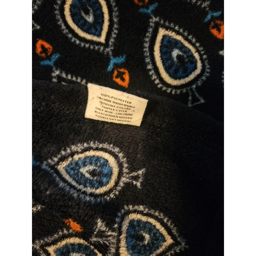 Vera Bradley Plush Throw Blanket features a Distinct Marrakesh Motifs Pattern.